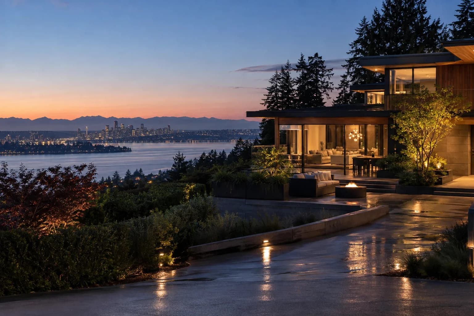 Northwest contemporary hillside home of timber and glass in Clyde Hill, Washington, with a hilltop view west over Lake Washington to the Seattle skyline and the Olympic Mountains