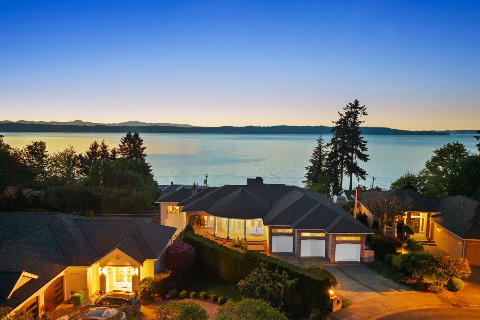 Aerial twilight view of 30809 36th Ct SW with Puget Sound and Olympic Mountains backdrop