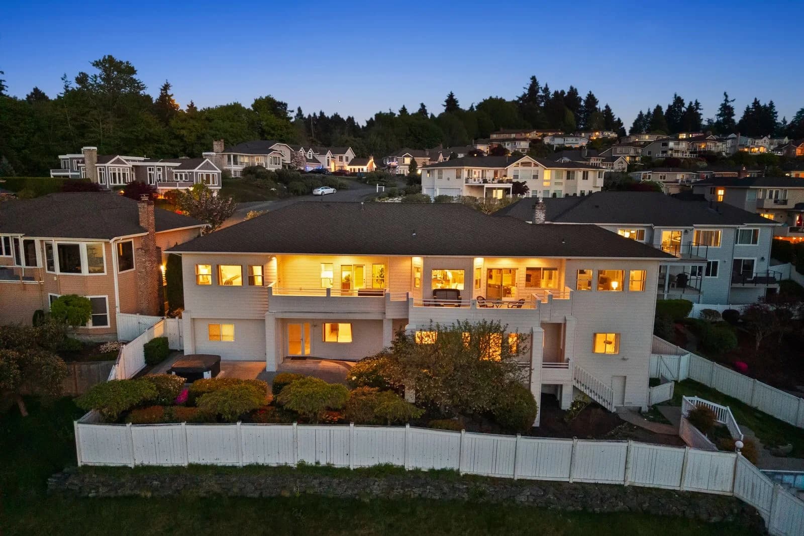 Twilight aerial rear view of Bayview Country Estates home