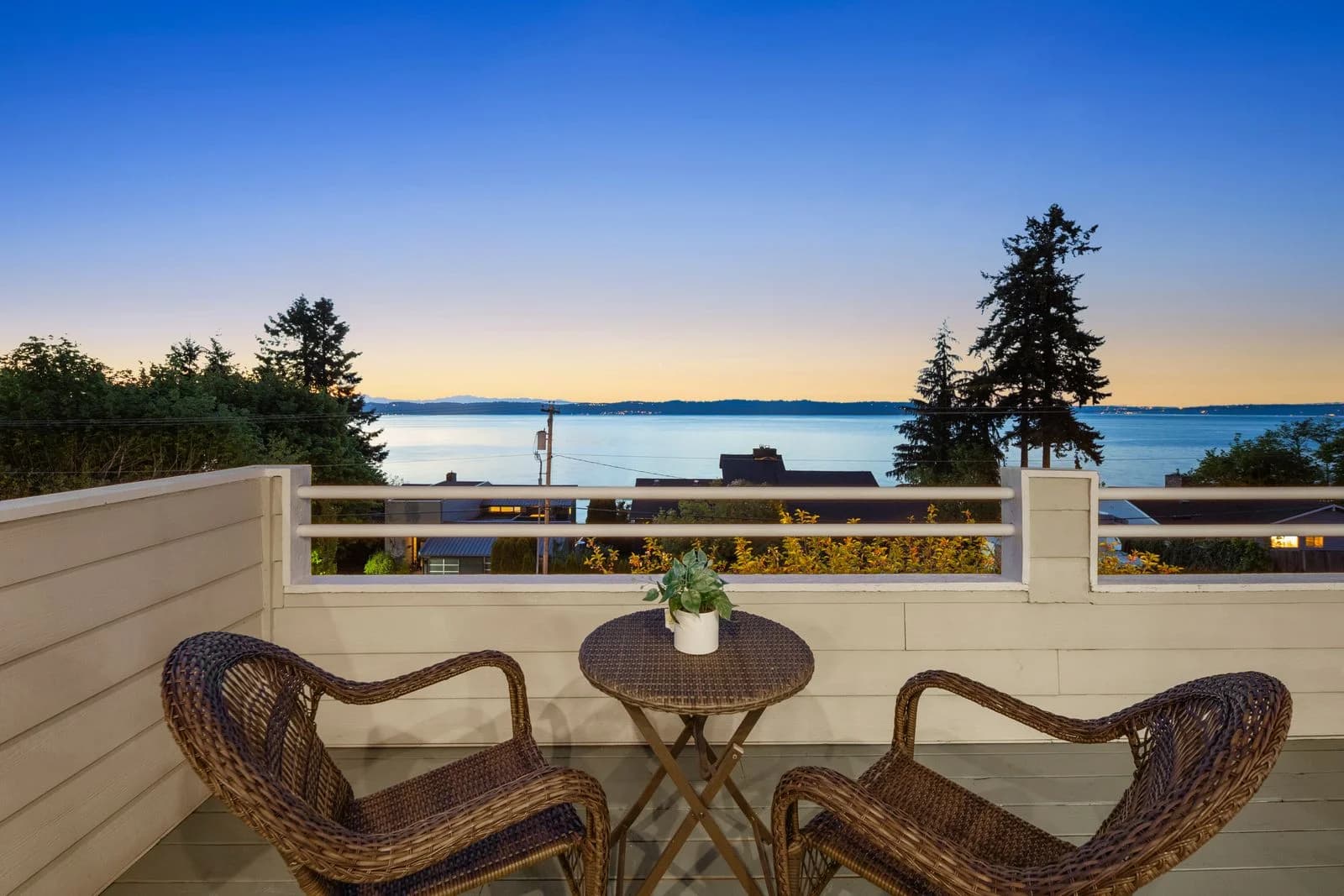 In-ground pool and hot tub at twilight