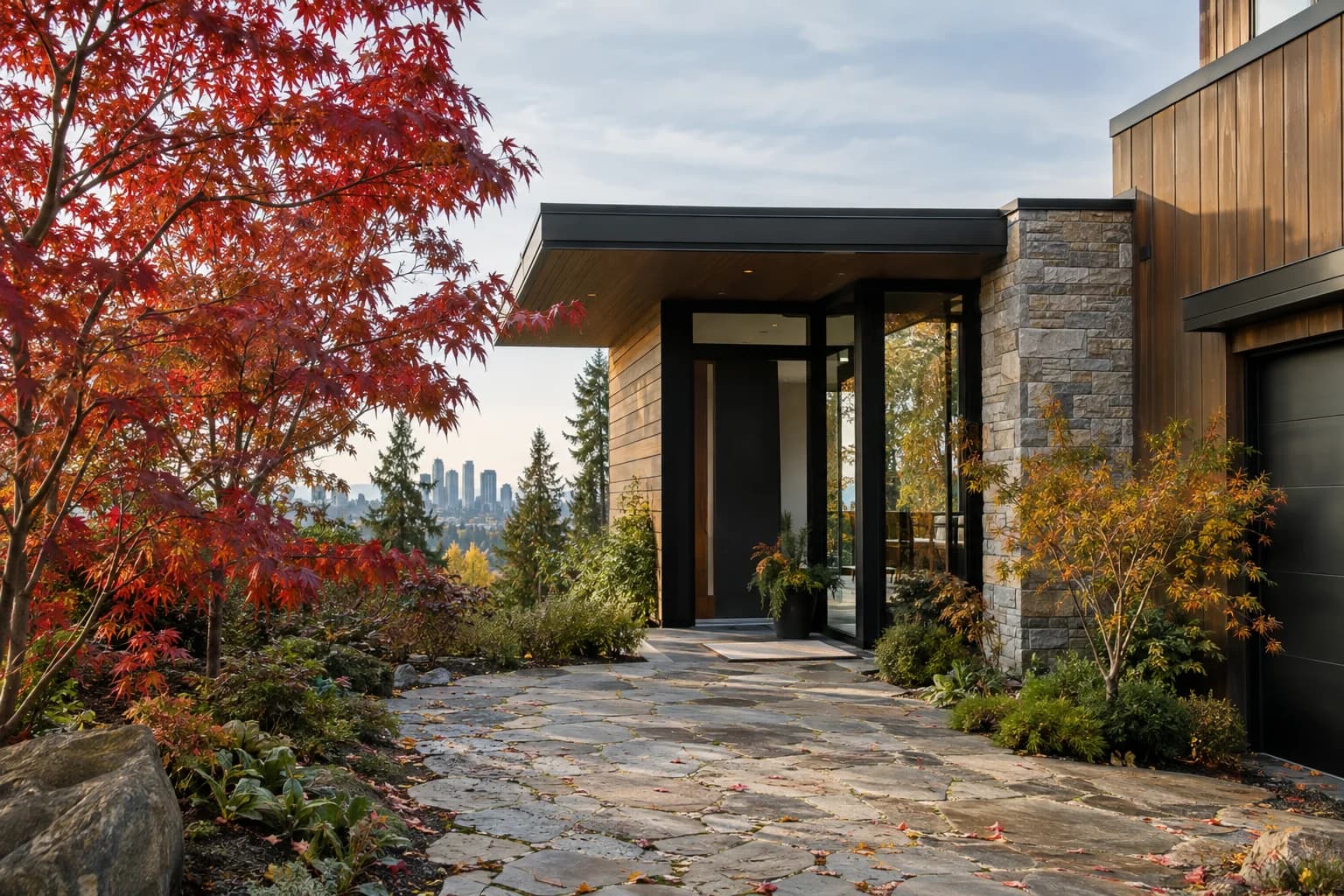 Crisp autumn driveway approach to a modern Northwest home, stone path and cedar siding in Bellevue — RexMont Real Estate