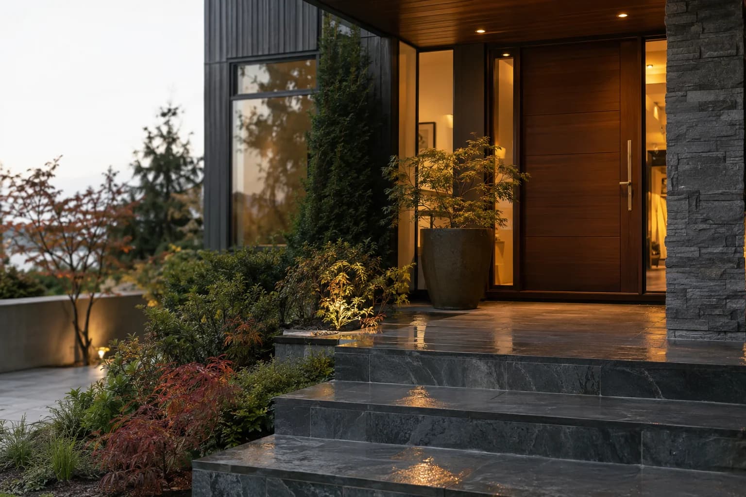 Close architectural entry detail with brass hardware, rain on slate steps in Bellevue — RexMont Real Estate