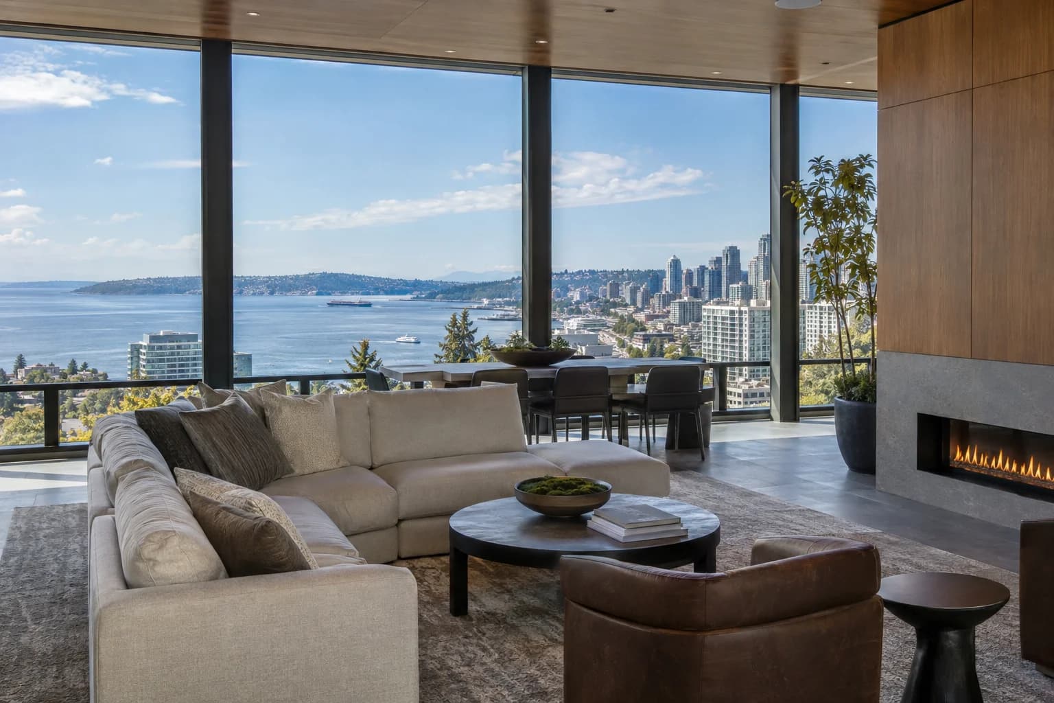 Amenity lounge with window wall and restrained city context in Seattle — RexMont Real Estate