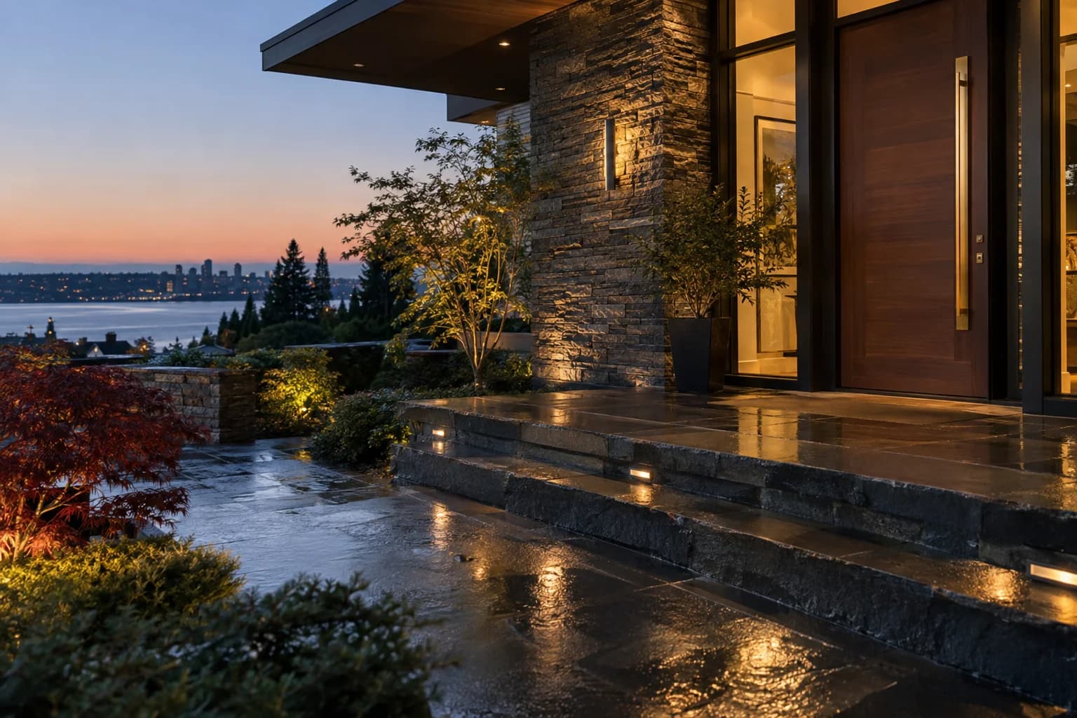 Close architectural entry detail with brass hardware, rain on slate steps in Bellevue — RexMont Real Estate