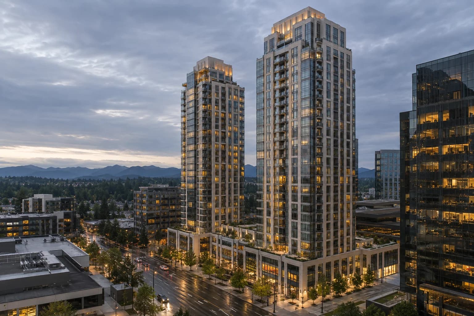 Twin cream-and-glass residential towers over a lit retail podium on a downtown Bellevue avenue at dusk — RexMont Real Estate